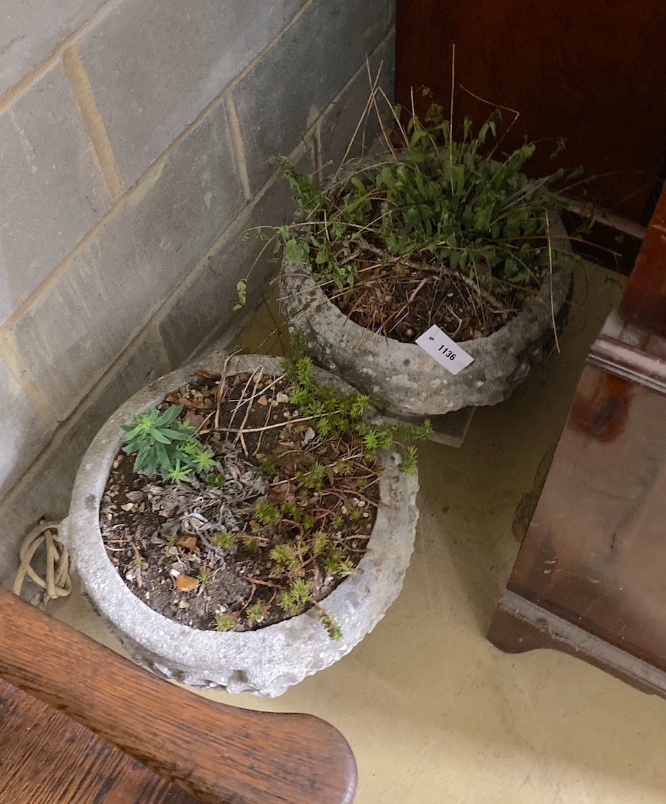 A pair of circular reconstituted stone garden planters, diameter 38cm, height 33cm